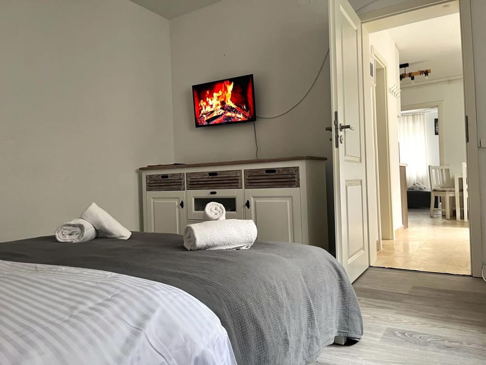 Bed, TV and multimedia, Bedroom, heating, towels, wardrobe