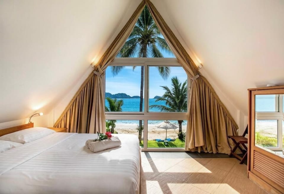 Bed, Garden, View (from property/room), Beach, Bedroom, Mountain view, Sea view, furniture, towels, wardrobe, air conditioner