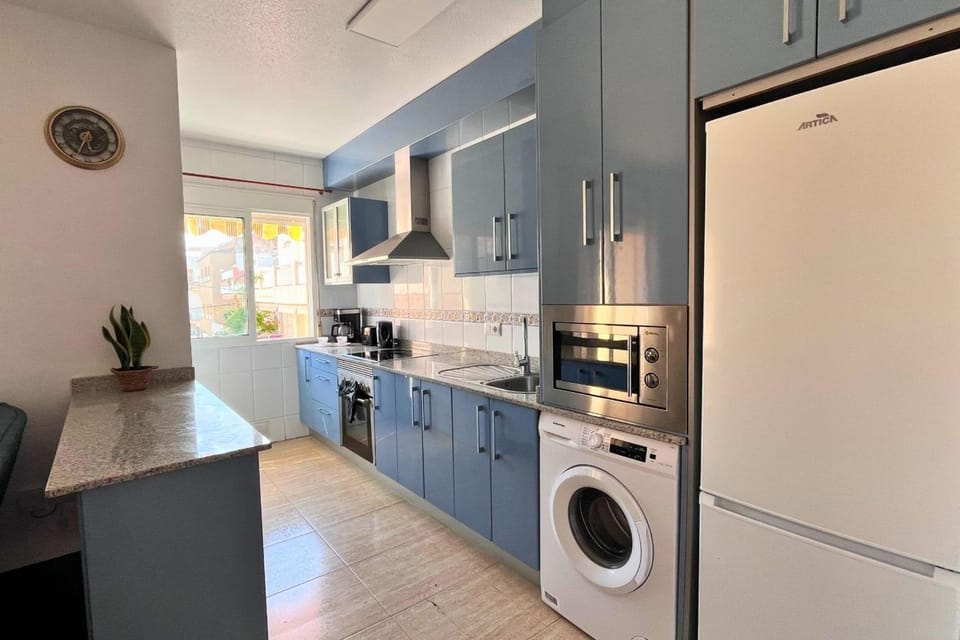 Kitchen or kitchenette, oven, stove, washing machine