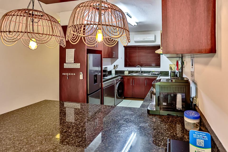 Kitchen or kitchenette, dishwasher, oven, stove