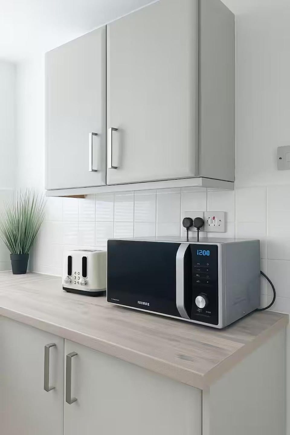 Kitchen or kitchenette, microwave, toaster