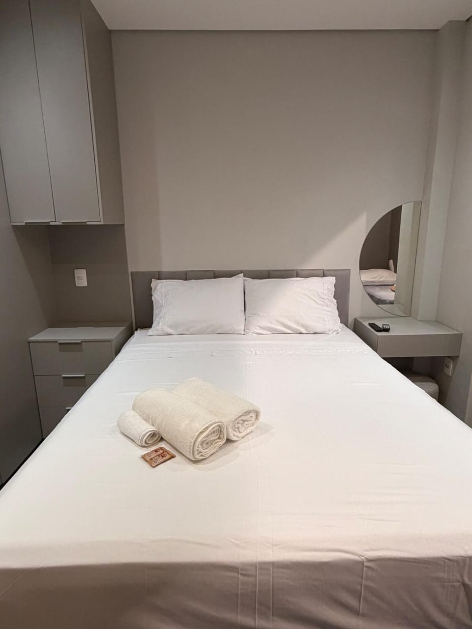Bed, towels, wardrobe