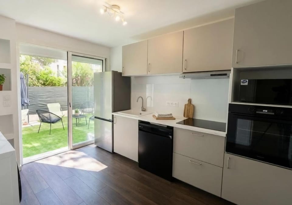 Kitchen or kitchenette, dishwasher, oven, stove