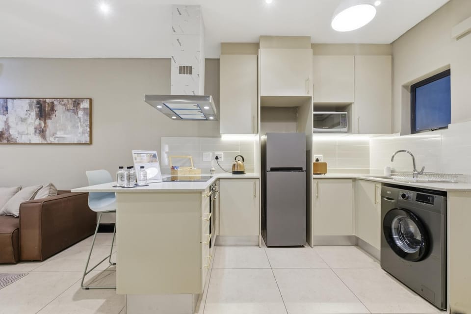 Coffee/tea facilities, Kitchen or kitchenette, Living room, Seating area, Dining area, microwave, oven, stove, toaster, washing machine