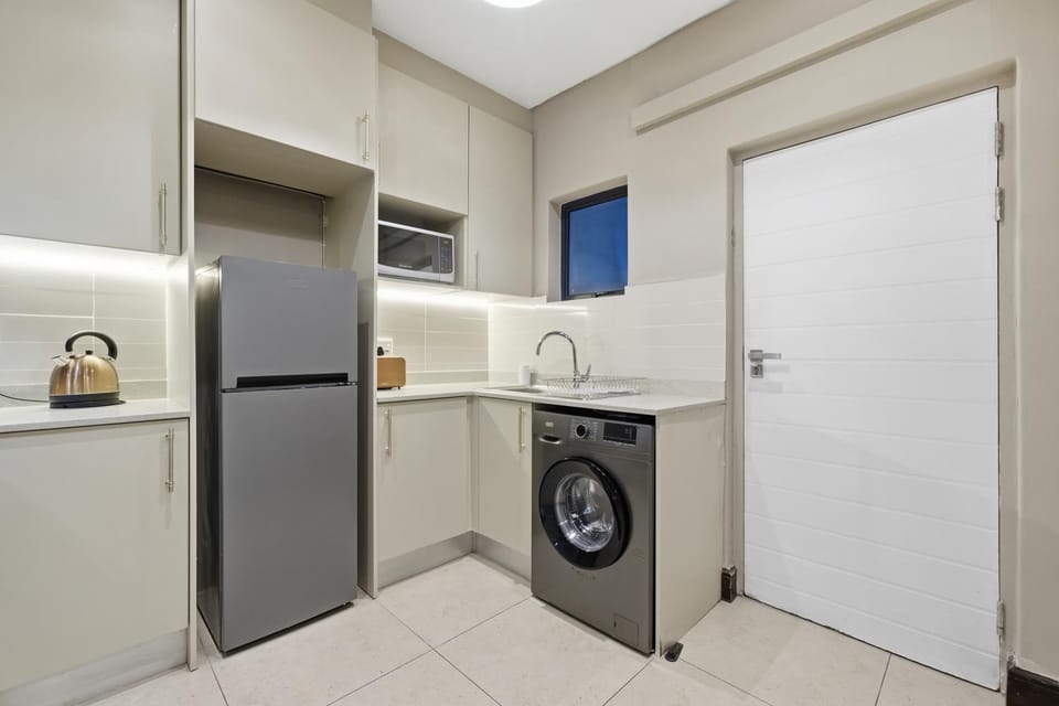 Kitchen or kitchenette, microwave, toaster, toaster, washing machine
