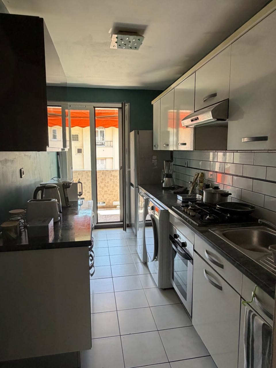 Kitchen or kitchenette, oven, stove, toaster, washing machine