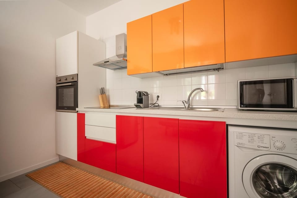 Kitchen or kitchenette, microwave, oven, stove, washing machine