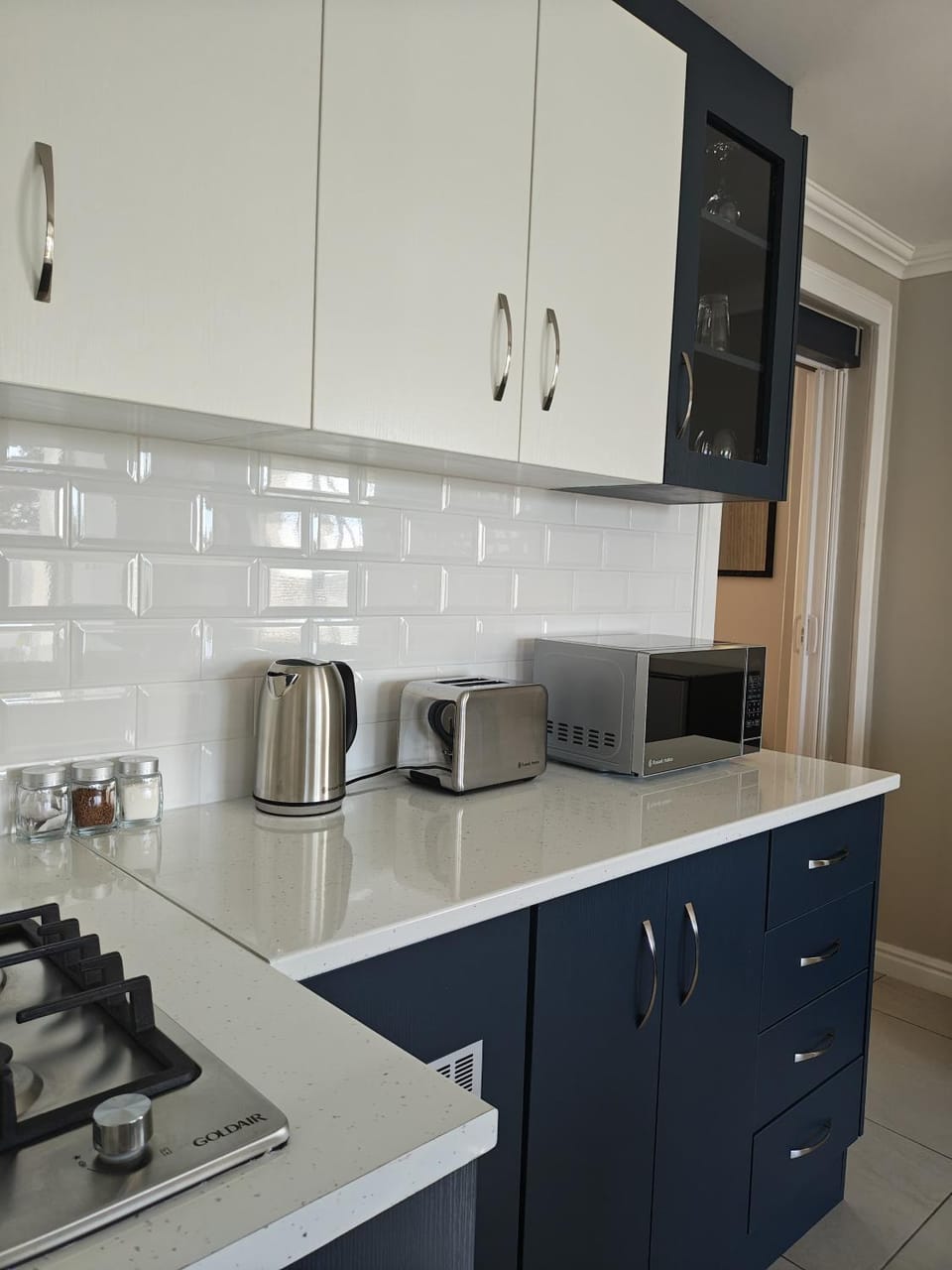 Kitchen or kitchenette, stove, toaster