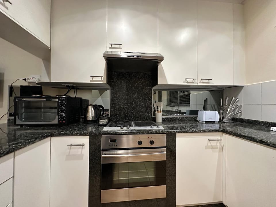 Kitchen or kitchenette, oven, stove, toaster