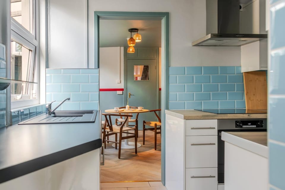 Kitchen or kitchenette, dishwasher, oven, stove