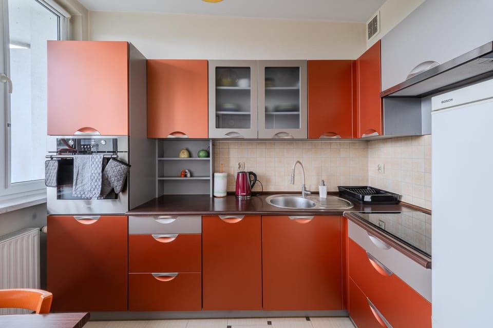 Kitchen or kitchenette, dishwasher, oven, stove