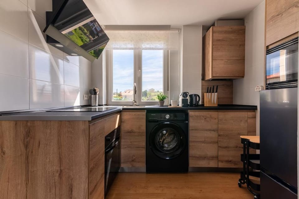Kitchen or kitchenette, stove, washing machine
