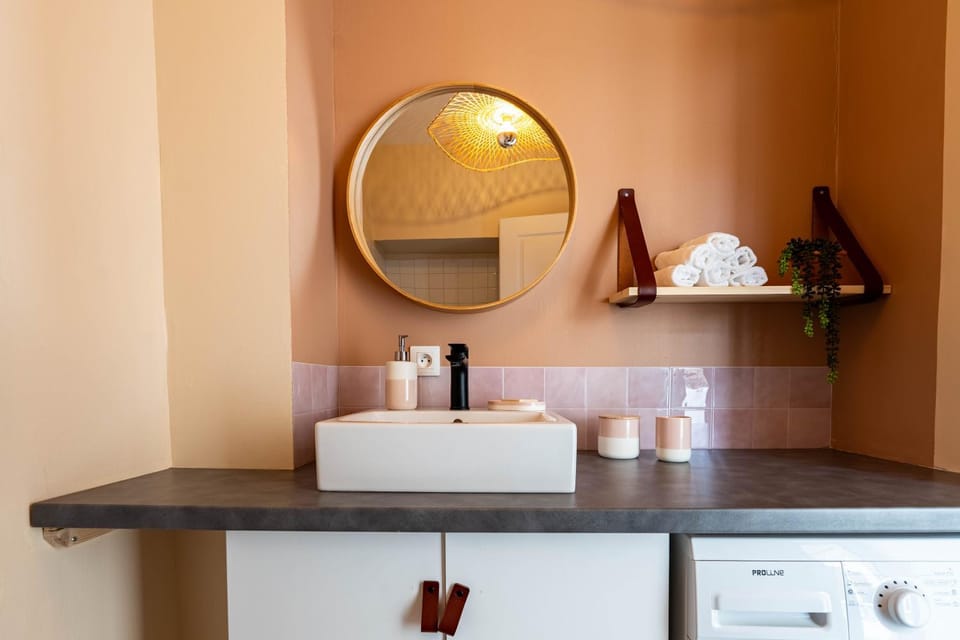 Toilet, towels, washing machine, washing machine