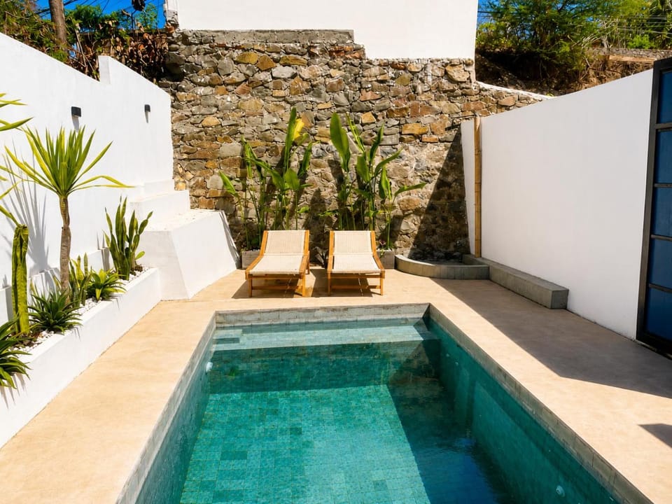 Property building, Patio, Off site, Day, Natural landscape, Pool view, Swimming pool, sunbed