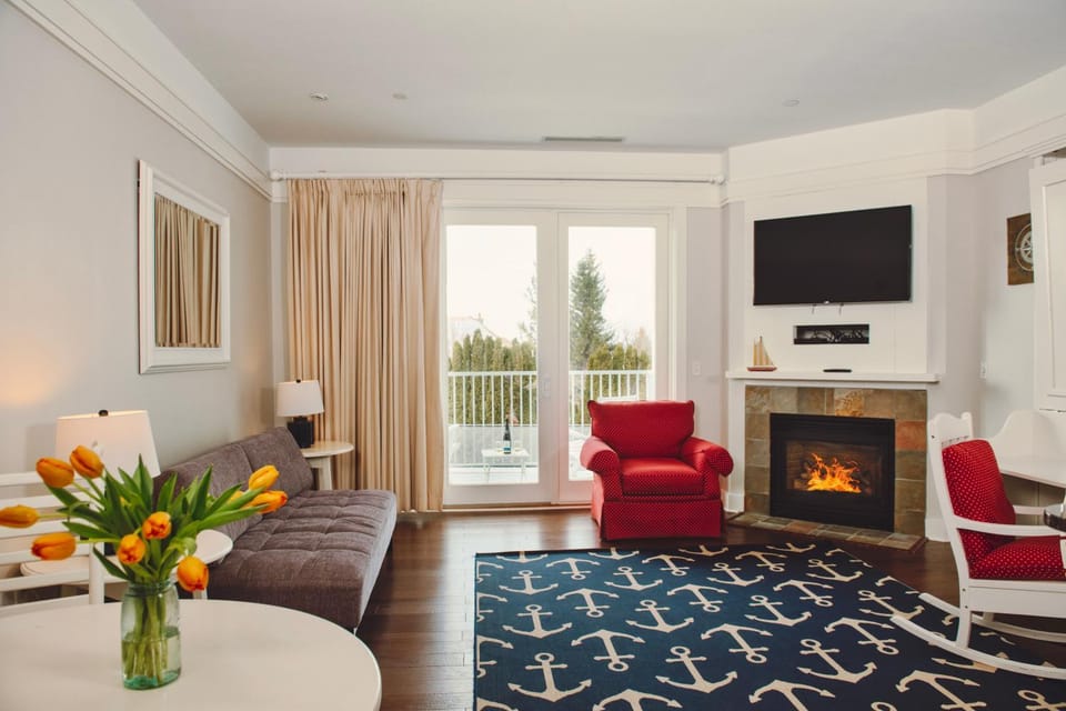 Experience luxury at Captain Suite 219 in Bay Harbor, MI, featuring a cozy bedroom and village view. Apartment in Bay Harbor