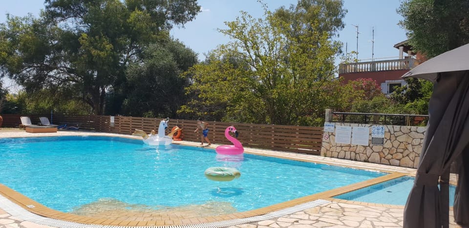 Property building, Living room, Swimming pool