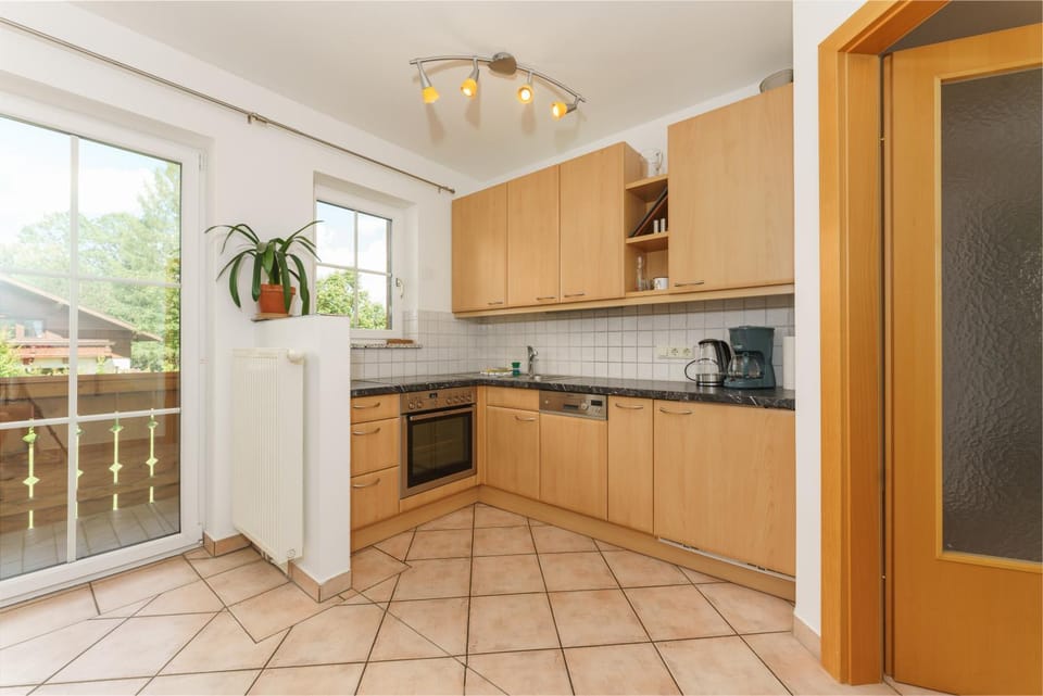 Kitchen or kitchenette, dishwasher, oven, stove