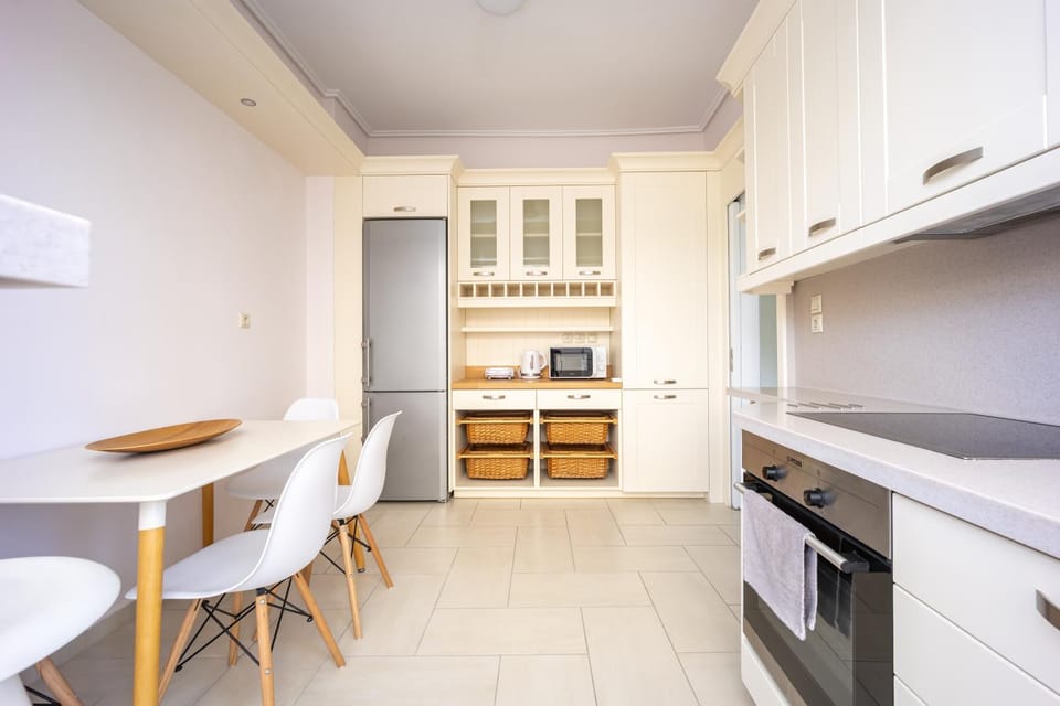 Kitchen or kitchenette, dishwasher, oven, stove, toaster