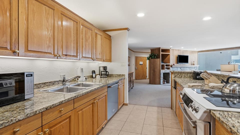 Kitchen or kitchenette, dishwasher, microwave, oven, stove, kitchen