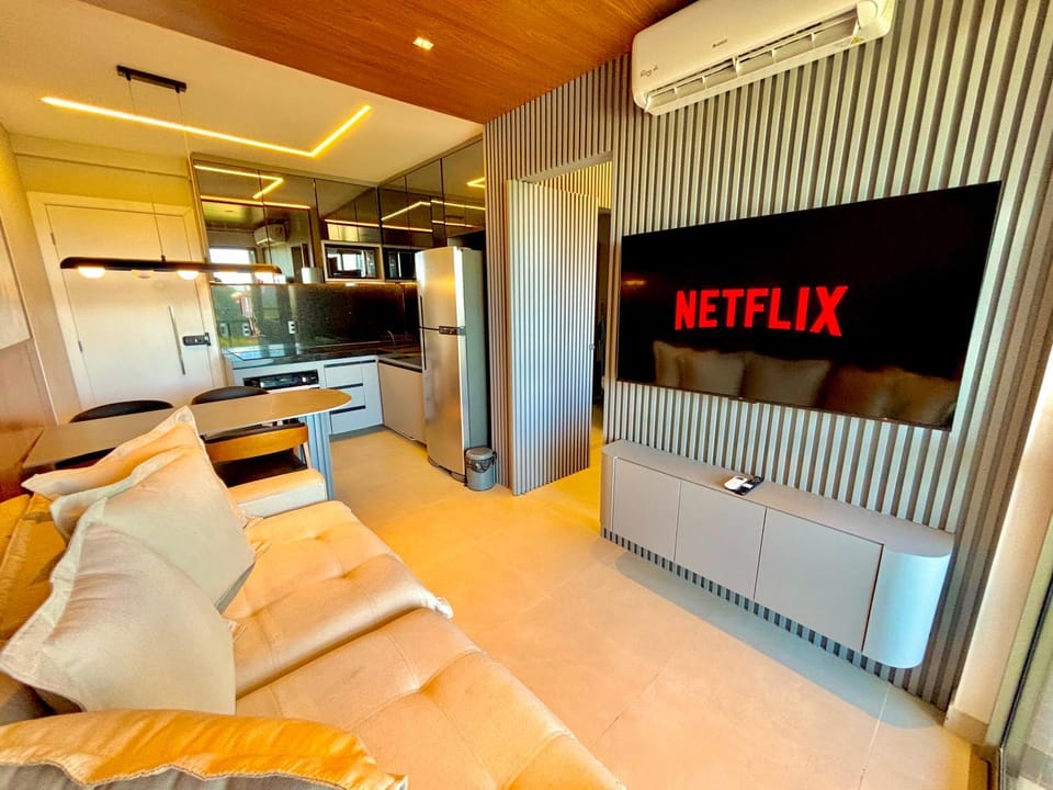 Communal lounge/ TV room, TV and multimedia, Kitchen or kitchenette, Living room, Dining area, furniture, internet, locker, microwave, oven, stove, toaster, kitchen, elevator, air conditioner