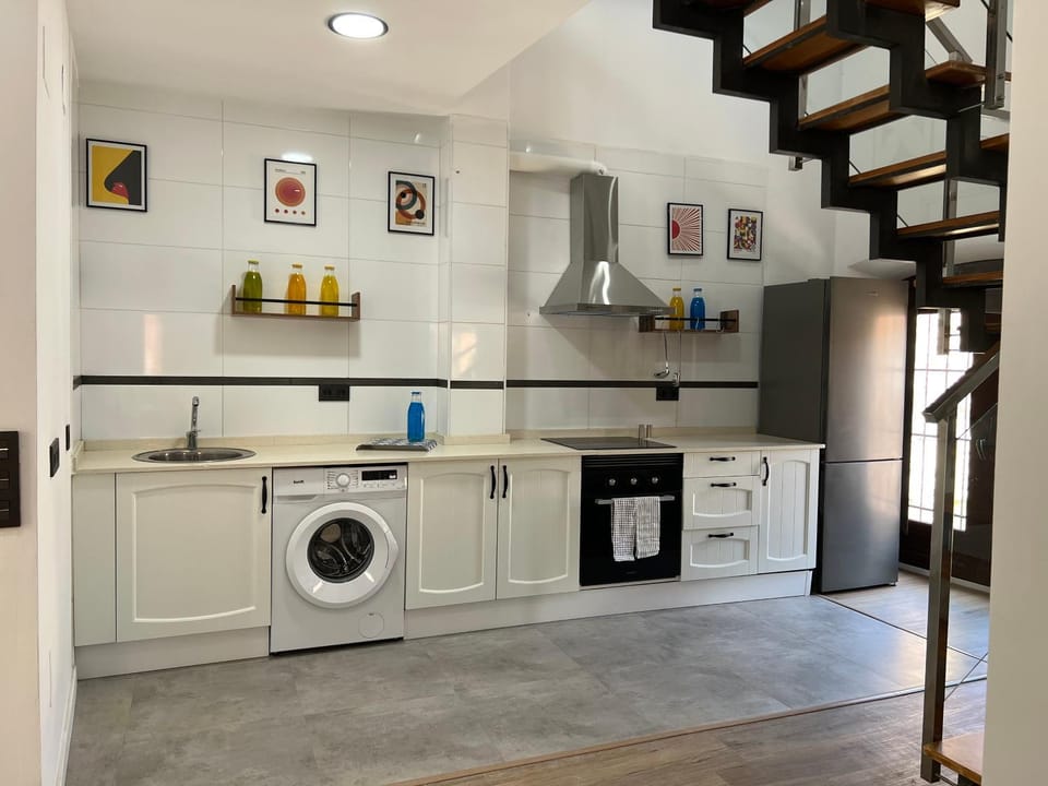 Kitchen or kitchenette, dishwasher, oven, stove, toaster, washing machine, dryer