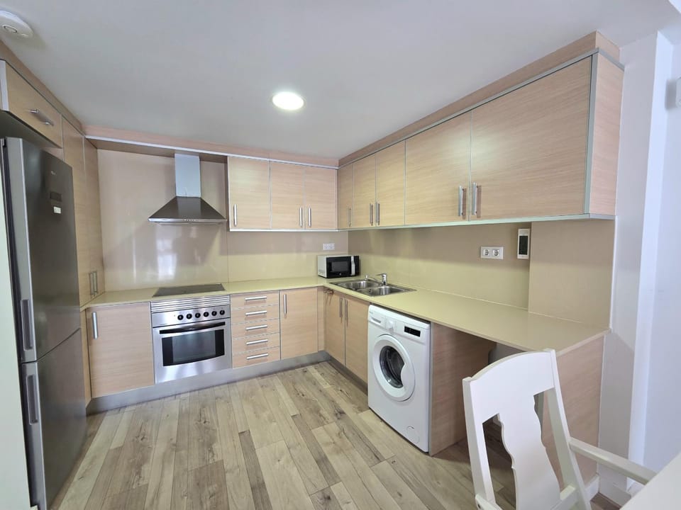Kitchen or kitchenette, oven, stove, washing machine