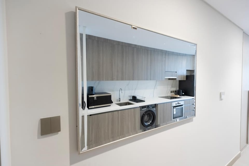 Kitchen or kitchenette, stove, toaster, washing machine
