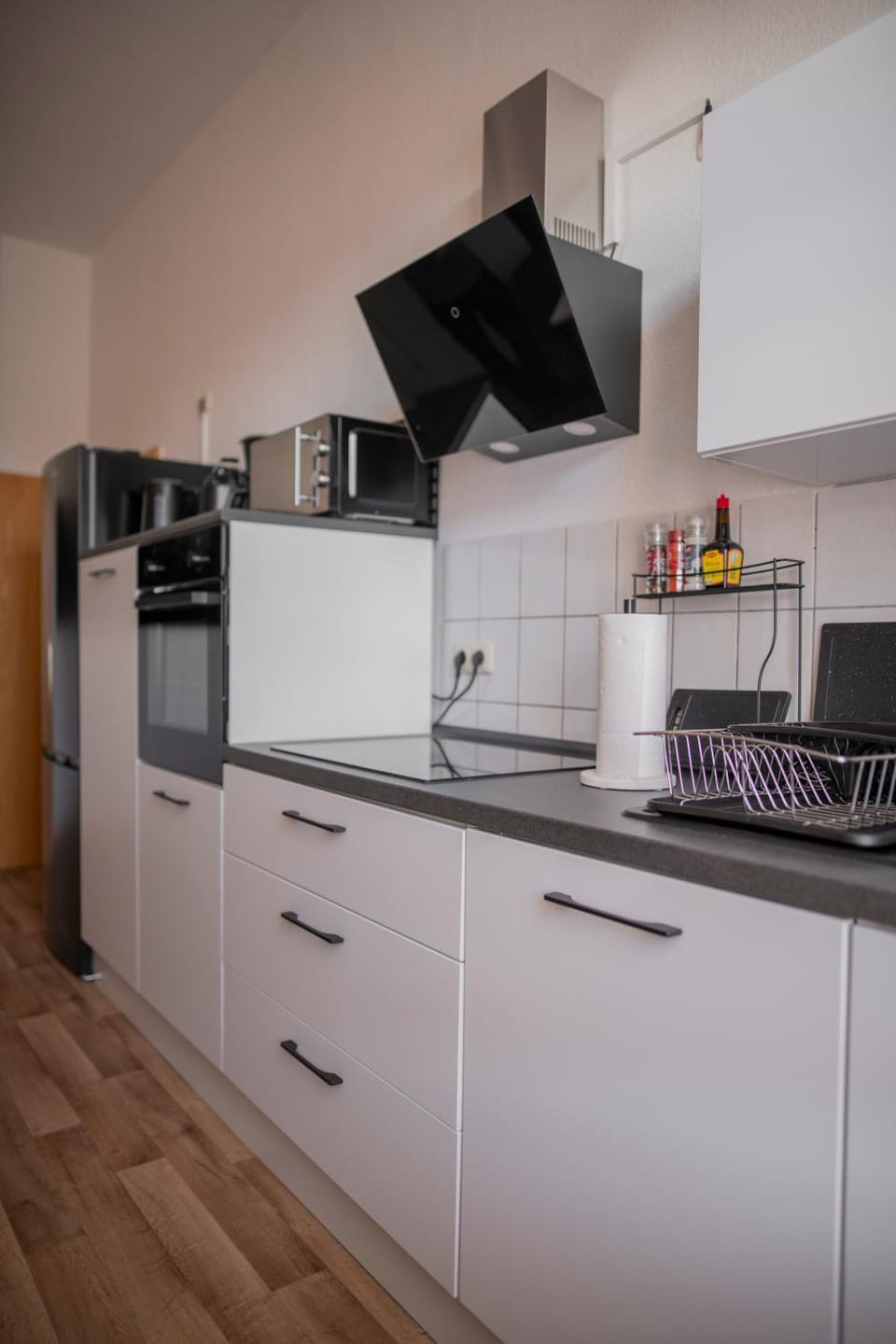 Kitchen or kitchenette, dishwasher, oven, stove