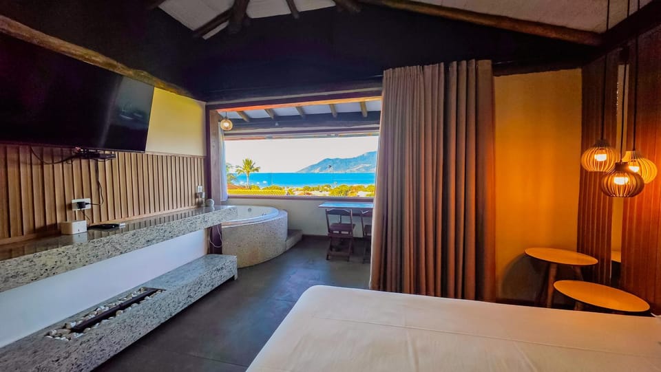 Studio Moderno com Vista pro mar com hidromassagem e churrasqueira privativas e Piscina aquecida na área comum Apartment in São Sebastião