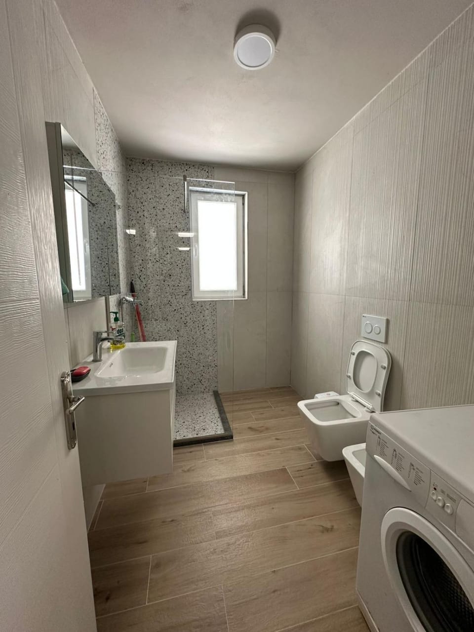 Toilet, Bathroom, towels, washing machine, dryer