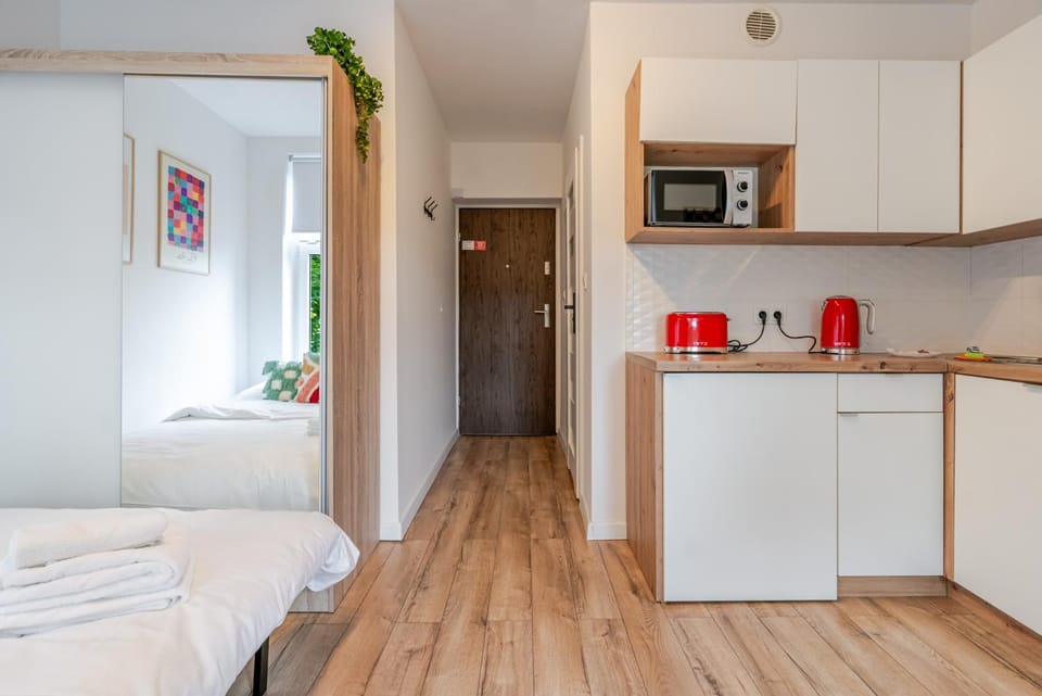 Bed, Kitchen or kitchenette, oven, stove, toaster, wardrobe