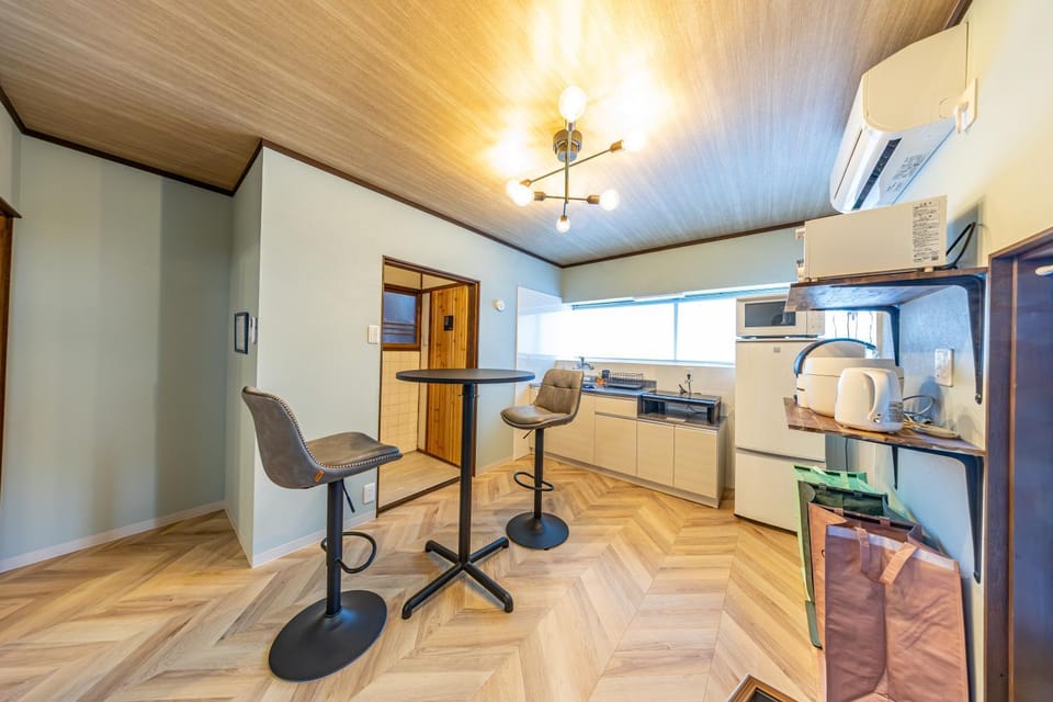 Photo of the whole room, toaster, kitchen, air conditioner