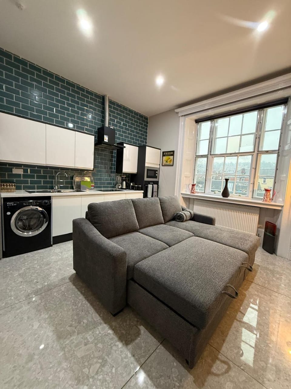Living room, Seating area, microwave, washing machine, kitchen