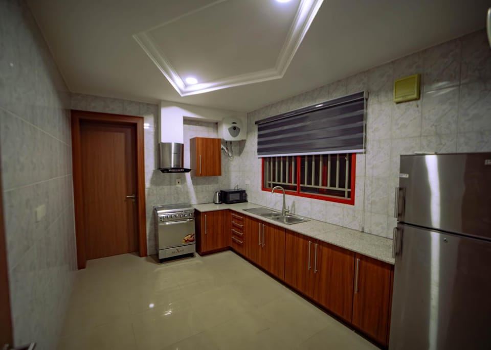 Kitchen or kitchenette, dishwasher, oven, stove