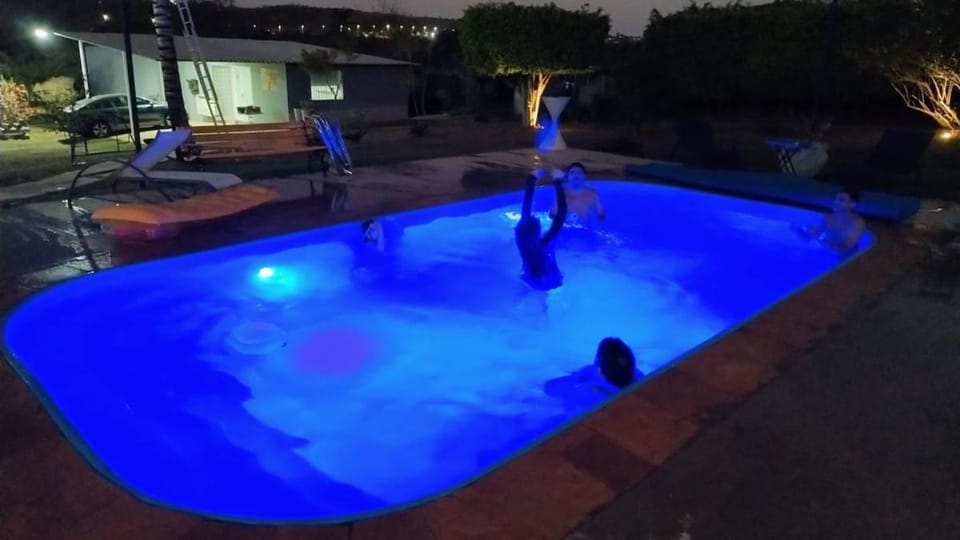 Night, People, Natural landscape, Pool view, Swimming pool, group of guests