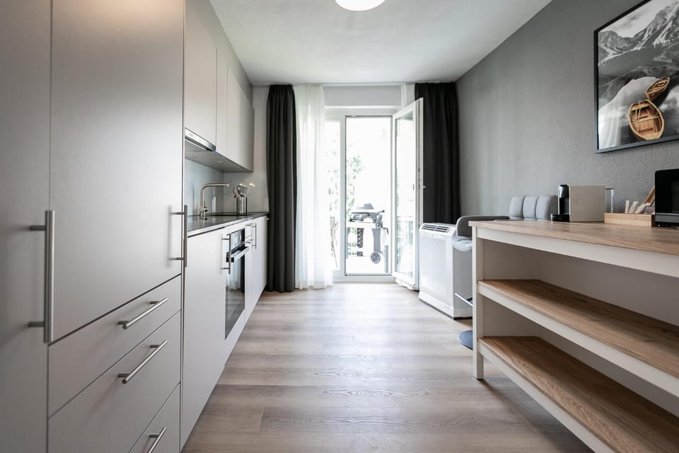 Kitchen or kitchenette, dishwasher, stove, washing machine