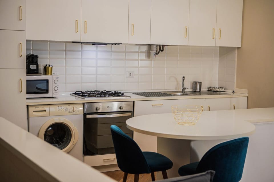Kitchen or kitchenette, Dining area, dishwasher, stove, washing machine