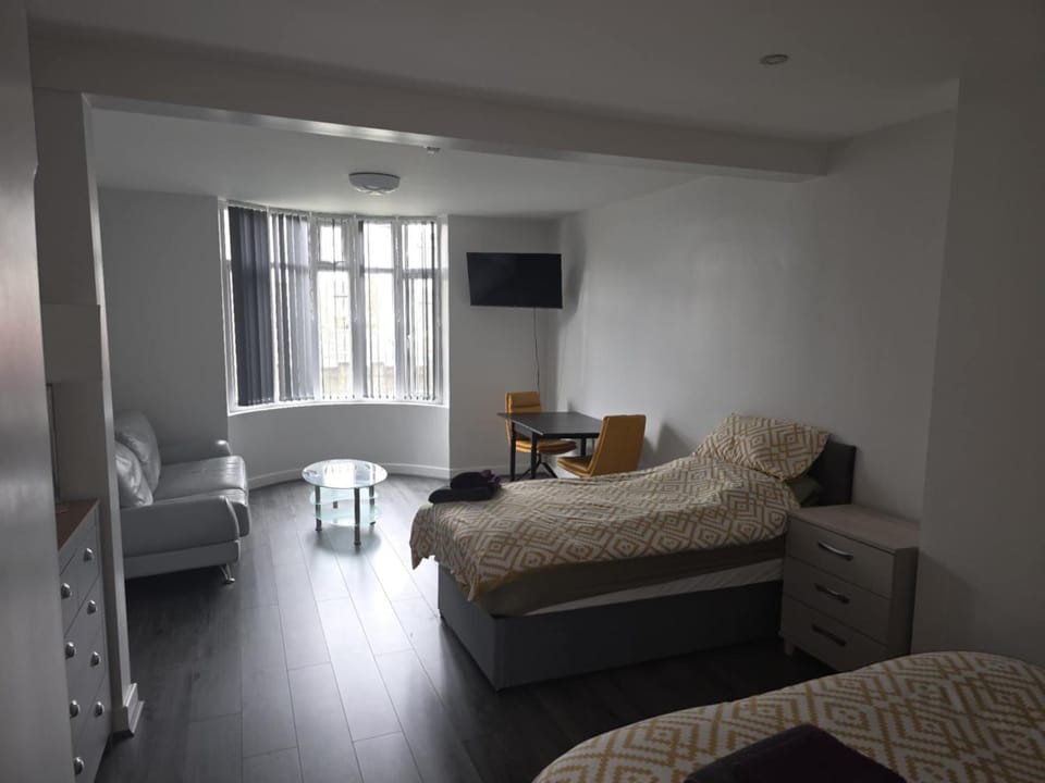 Bed, Living room, Seating area, Bedroom