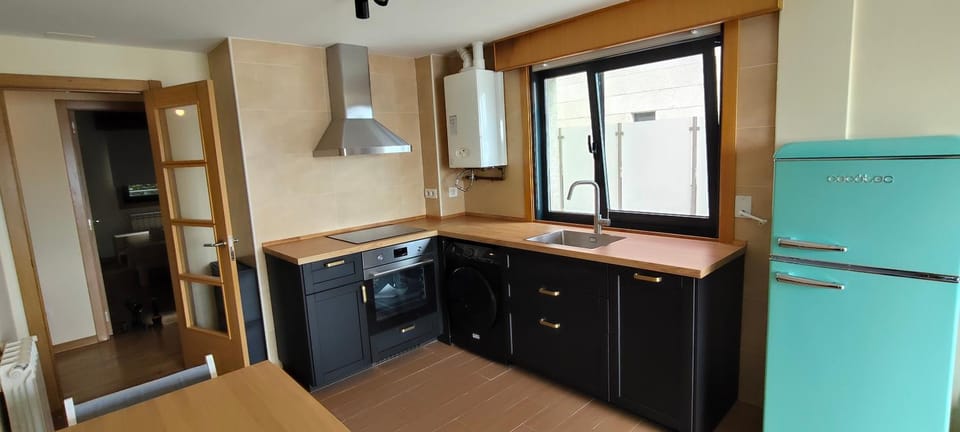 Kitchen or kitchenette, dishwasher, oven, stove