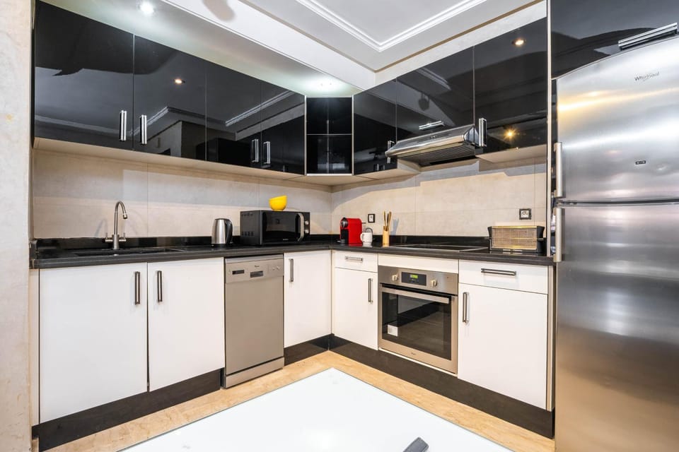 Kitchen or kitchenette, dishwasher, oven, stove, toaster