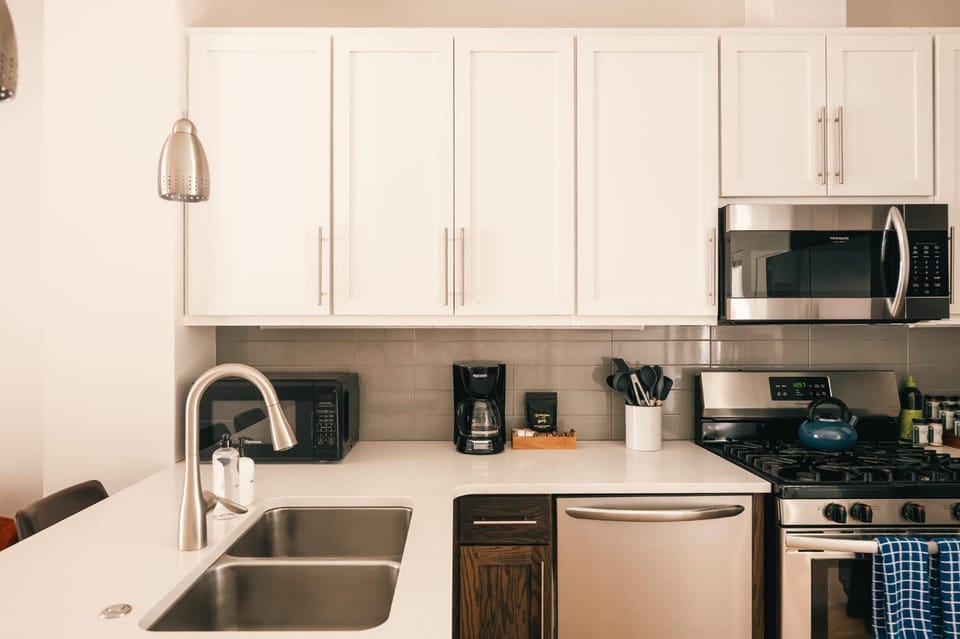 Kitchen or kitchenette, dishwasher, oven, stove