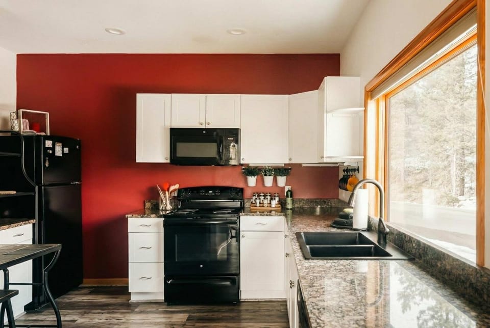 Kitchen or kitchenette, dishwasher, oven, stove, toaster