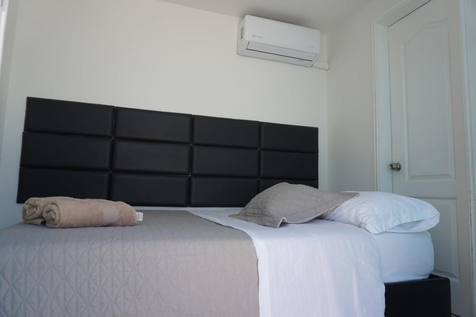 Bed, Photo of the whole room, Bedroom, towels, air conditioner