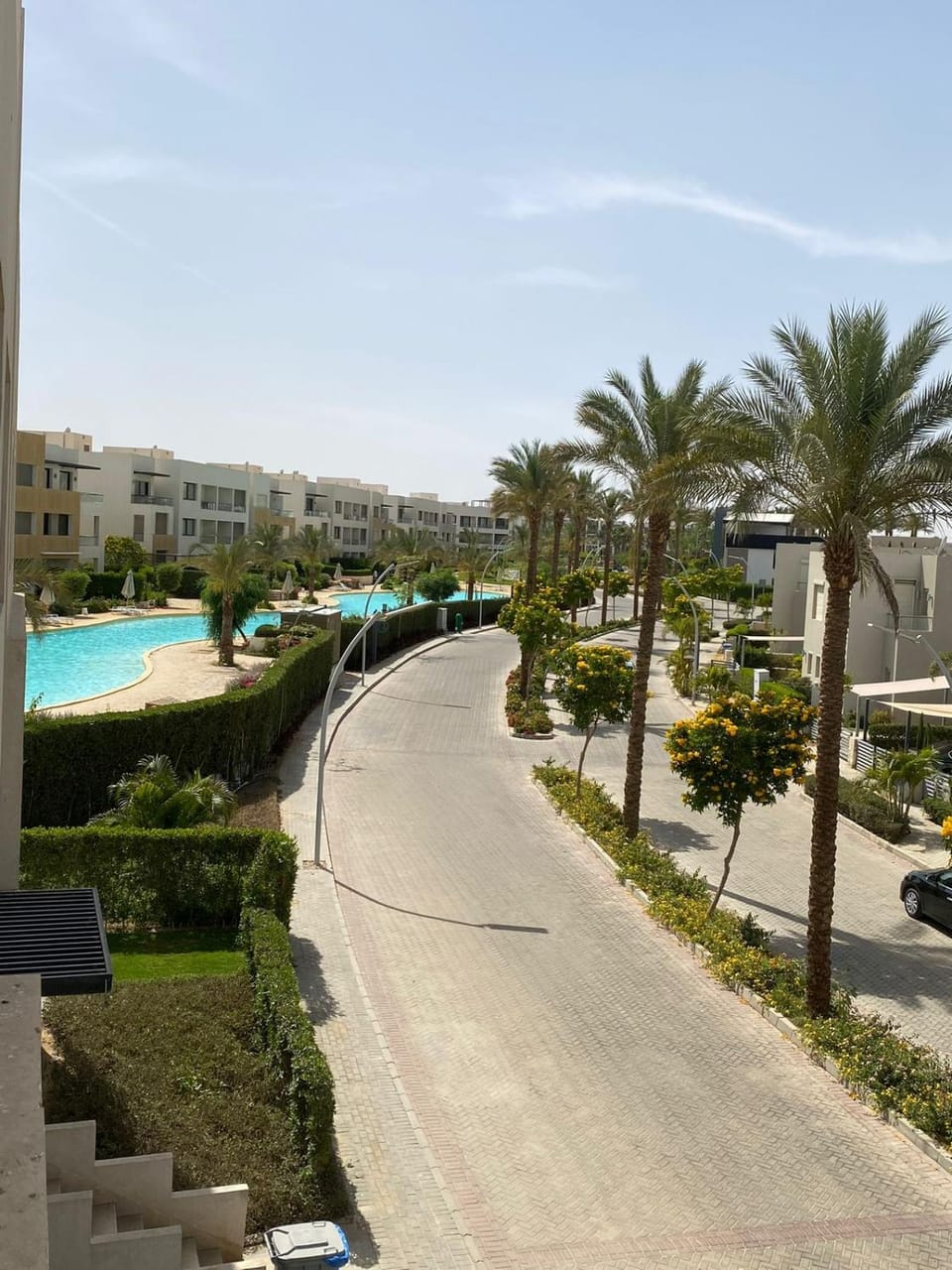 Property building, Day, Neighbourhood, Natural landscape, Pool view, Street view, Swimming pool, sunbed