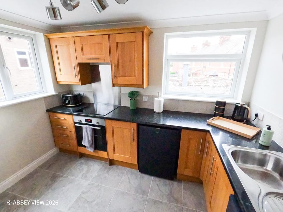 Kitchen or kitchenette, dishwasher, oven, stove, toaster