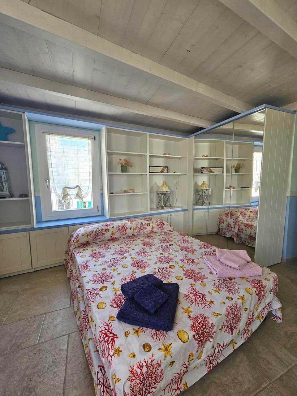 Bed, towels, wardrobe