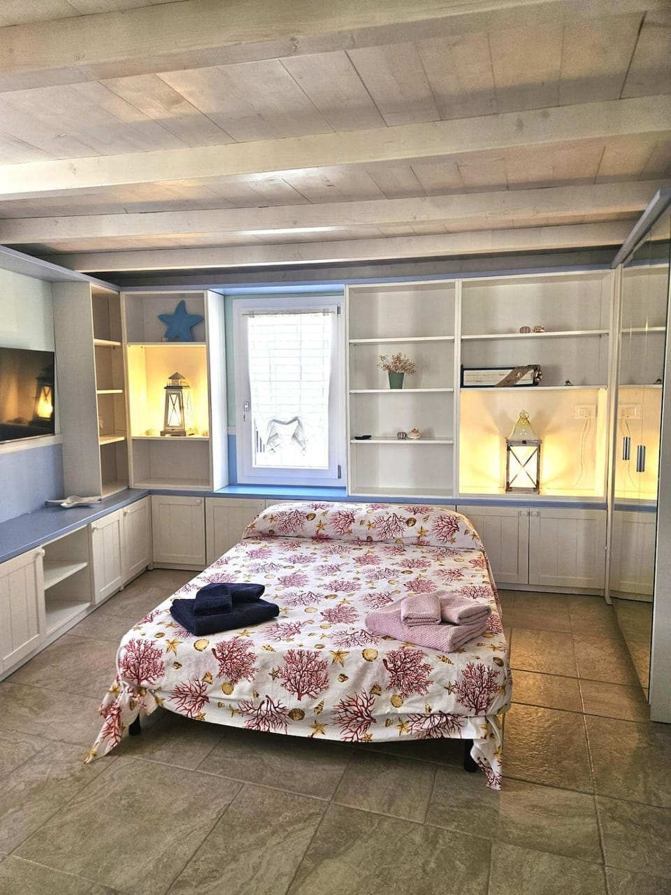 Bed, towels, wardrobe