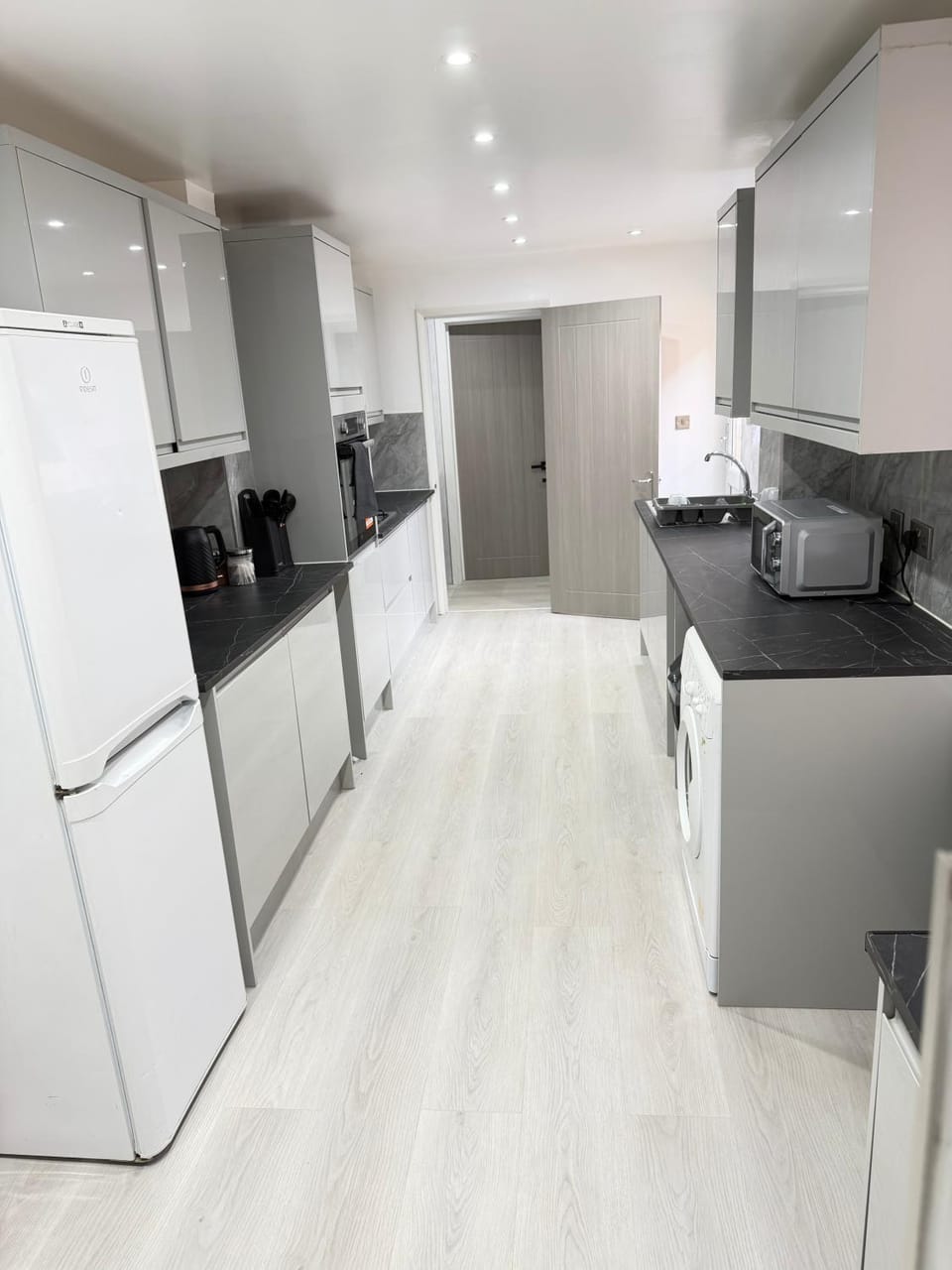 Kitchen or kitchenette, dishwasher, oven, stove