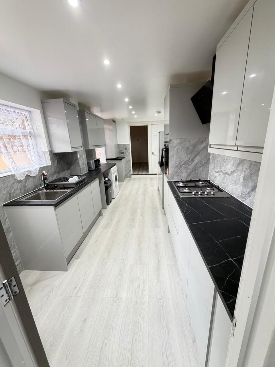 Kitchen or kitchenette, dishwasher, oven, stove