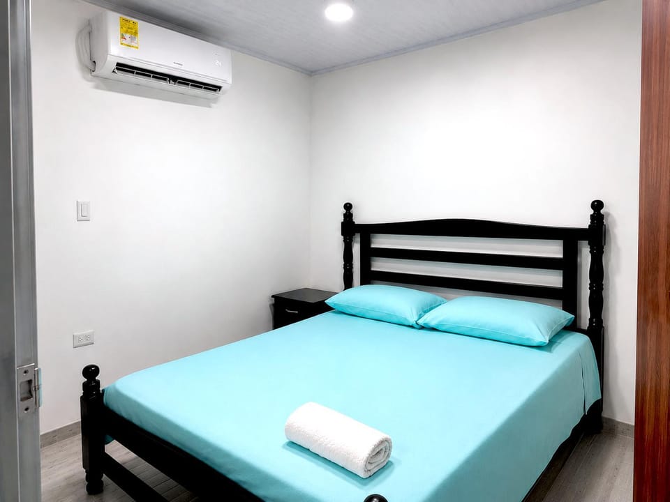 Bed, Photo of the whole room, Bedroom, towels, air conditioner
